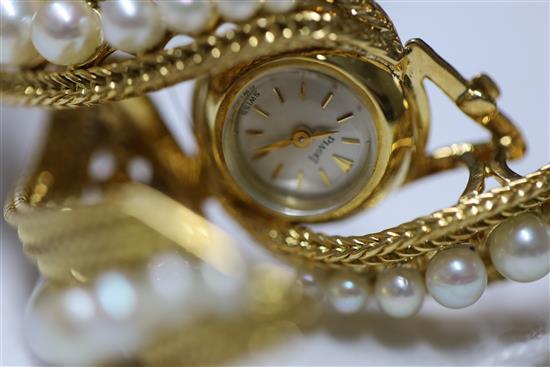 A ladys 20th century Piaget 18ct gold and graduated cultured pearl set manual back wind cocktail watch,